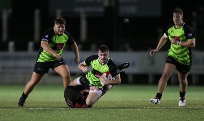 140120 - Coleg y Cymoedd v Coleg Gwent, WRU National Schools and Colleges League Final - Ryan Wilkins of Coleg y Cymoedd is tackled by Morgan Lloyd of Coleg Gwent