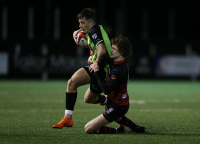 140120 - Coleg y Cymoedd v Coleg Gwent, WRU National Schools and Colleges League Final - Cameron Winnett of Coleg y Cymoedd is tackled by Carrick McDonough of Coleg Gwent