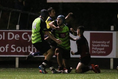 140120 - Coleg y Cymoedd v Coleg Gwent, WRU National Schools and Colleges League Final - Cameron Winnett of Coleg y Cymoedd is tackled by Carrick McDonough of Coleg Gwent