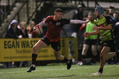 140120 - Coleg y Cymoedd v Coleg Gwent, WRU National Schools and Colleges League Final - Olly Andrews of Coleg Gwent hands off Cavan Davies of Coleg y Cymoedd