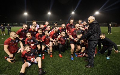 140120 - Coleg y Cymoedd v Coleg Gwent, WRU National Schools and Colleges League Final - Connor Chapman captain of Coleg Gwent is presented with the trophy by Rob Butcher of the WRU