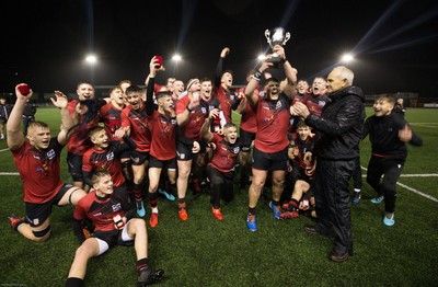 140120 - Coleg y Cymoedd v Coleg Gwent, WRU National Schools and Colleges League Final - Connor Chapman captain of Coleg Gwent is presented with the trophy by Rob Butcher of the WRU