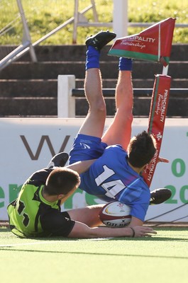 051016 - Coleg y Cymoedd v Gower College, WRU Wednesday U18 League - Jake Tucker of Gower College is tackled by Eddie Francis of Coleg y Cymoedd