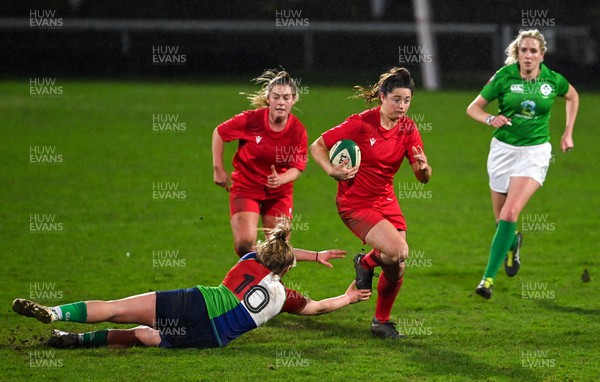 180223 - Combined Provinces XV v Welsh Development XV - Celtic Challenge - Robyn Wilkins of Wales Development XV evades the tackle of Dannah O'Brien of Combined Provinces XV