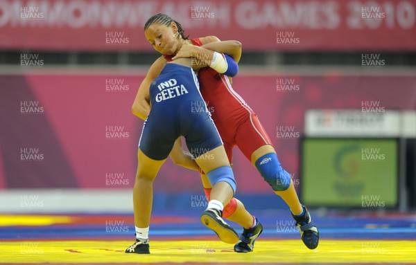 071010 - Commonwealth Games Delhi 2010 - Non Evans(red) of Wales competes with Geeta of India in the freestyle 55 kg women wrestling