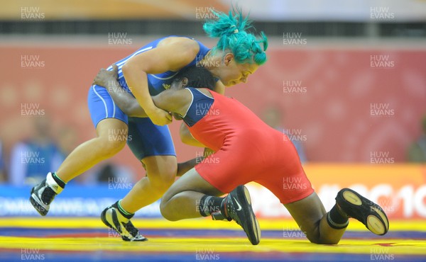 071010 - Commonwealth Games Delhi 2010 - Kate Rennie(blue) of Wales competes with Leah Wambui Ndungu of Kenya in the freestyle 63 kg women wrestling