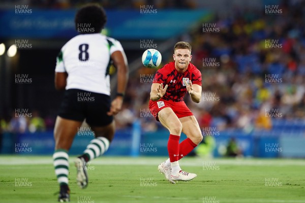 140418 - Rugby Sevens - Commonwealth Games - Ethan Davies of Wales in action
