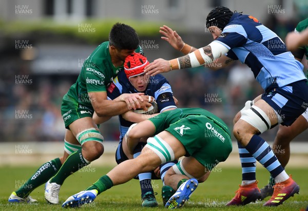 130419 -  Connacht v Cardiff Blues - Guinness PRO14 -  Seb Davies of Cardiff Blues is tackled by Jarrad Butler, left, and Colby Fainga�a of Connacht