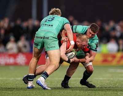 050425 - Connacht v Cardiff Rugby -EPCR Challenge Cup Round of 16 - Keiron Assiratti of Cardiff Rugby is tackled by Hugh Gavin, left, and Oisín Dowling of Connacht