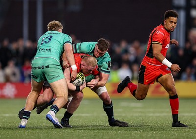 050425 - Connacht v Cardiff Rugby -EPCR Challenge Cup Round of 16 - Keiron Assiratti of Cardiff Rugby is tackled by Hugh Gavin, left, and Oisín Dowling of Connacht