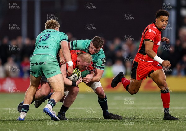 050425 - Connacht v Cardiff Rugby -EPCR Challenge Cup Round of 16 - Keiron Assiratti of Cardiff Rugby is tackled by Hugh Gavin, left, and Oisín Dowling of Connacht