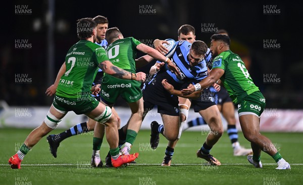 150423 - Connacht v Cardiff Rugby - United Rugby Championship - Max Llewellyn of Cardiff is tackled by Bundee Aki, right, and Jack Carty of Connacht