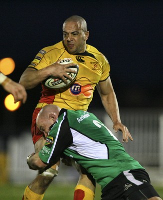 17.03.10 Connacht v Dragons... Newport Gwent Dragons Gavin Thomas is tackled by Connacht's Adrian Flavin. 