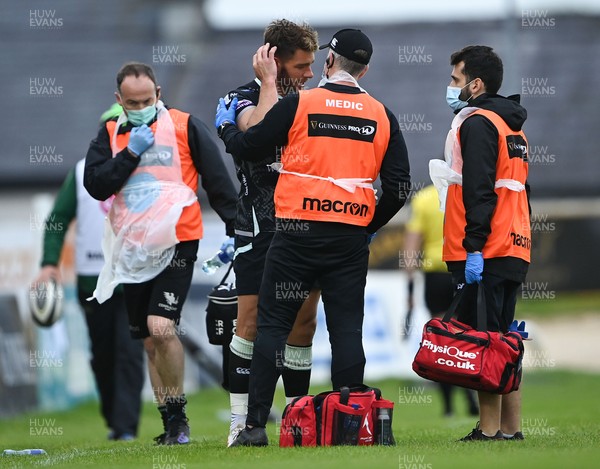 040621 - Connacht v Ospreys - Guinness PRO14 Rainbow Cup - Rhys Webb of Ospreys receives medical attention for an injury