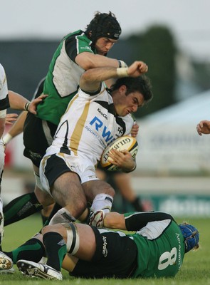 Magners League, Sportsground, Galway 4/9/2009 Connacht vs Ospreys Connacht's Andrew Browne and Mike McComish tackle Mike Philips of Ospreys 