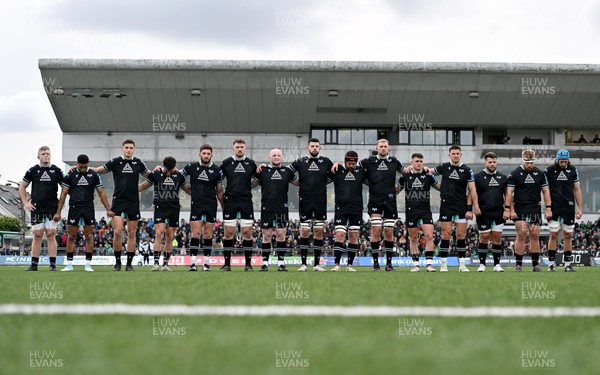 211023 - Connacht v Ospreys - United Rugby Championship - The Ospreys team stand for a minutes silence in respect to all those affected by the current crisis in Gaza and Israel