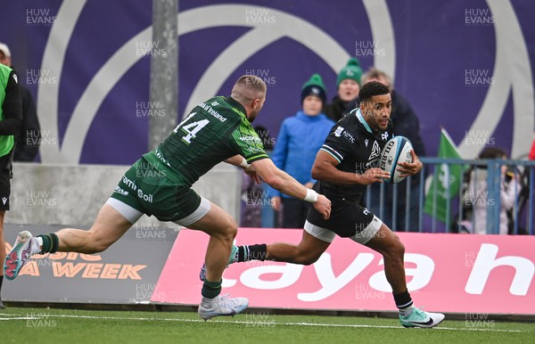 211023 - Connacht v Ospreys - United Rugby Championship - Keelan Giles of Ospreys on his way to score his side's first try despite the efforts of Diarmuid Kilgallen of Connacht