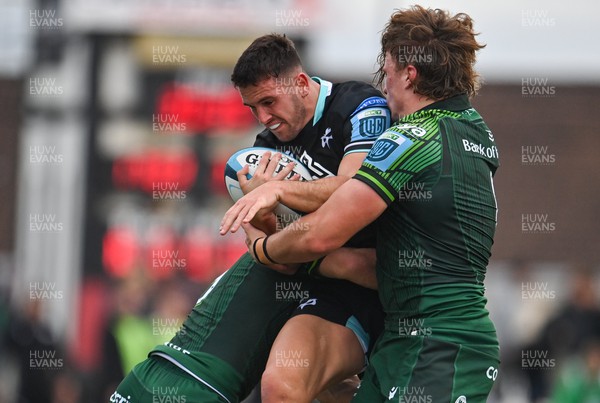 211023 - Connacht v Ospreys - United Rugby Championship - Owen Watkin of Ospreys is tackled by Caolin Blade, left, and Cian Prendergast of Connacht