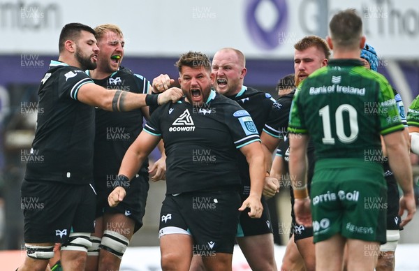 211023 - Connacht v Ospreys - United Rugby Championship - Tom Botha of Ospreys, centre, celebrates with teammates, from left, Rhys Davies, Will Griffiths and Ethan Lewis after being awarded a penalty