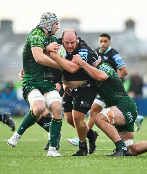 211023 - Connacht v Ospreys - United Rugby Championship - Rhys Henry of Ospreys is tackled by Niall Murray of Connacht, left, and Shamus Hurley-Langton