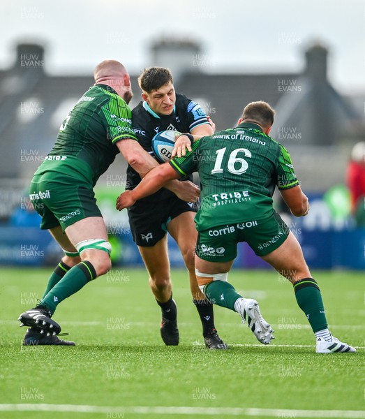 211023 - Connacht v Ospreys - United Rugby Championship - Max Nagy of Ospreys is tackled by Joe Joyce of Connacht, left, and Tadgh McElroy