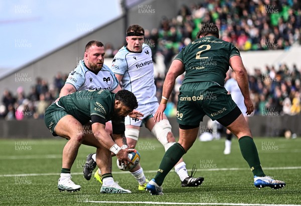 280326 - Connacht Rugby v Ospreys, United Rugby Championship - Bundee Aki of Connacht claims the ball under pressure from Steffan Thomas of Ospreys