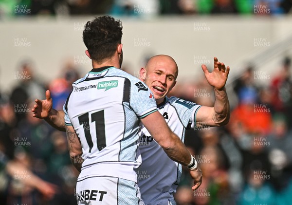 280326 - Connacht Rugby v Ospreys, United Rugby Championship -  Luke Morgan of Ospreys, 11, celebrates with team-mate Luke Davies after scoring their side's second try