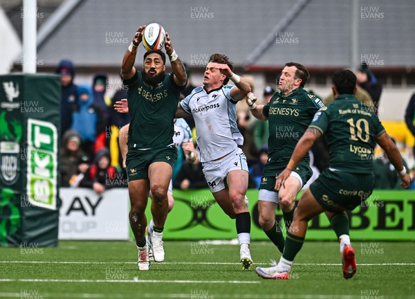 280326 - Connacht Rugby v Ospreys, United Rugby Championship - Bundee Aki of Connacht wins the ball from Jack Walsh of Ospreys