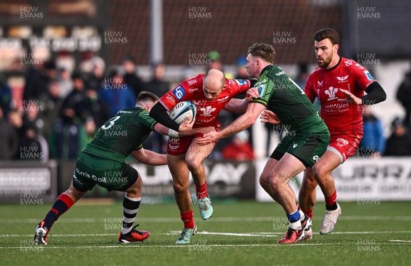 020324 - Connacht v Scarlets - United Rugby Championship - Ioan Nicholas of Scarlets is tackled by David Hawkshaw, left, and Cathal Forde of Connacht