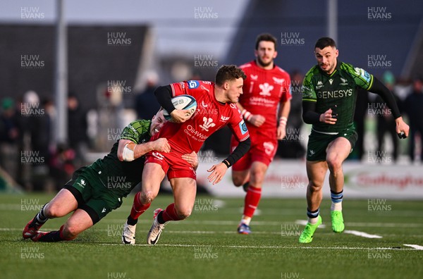 020324 - Connacht v Scarlets - United Rugby Championship - Tomi Lewis of Scarlets is tackled by David Hawkshaw of Connacht