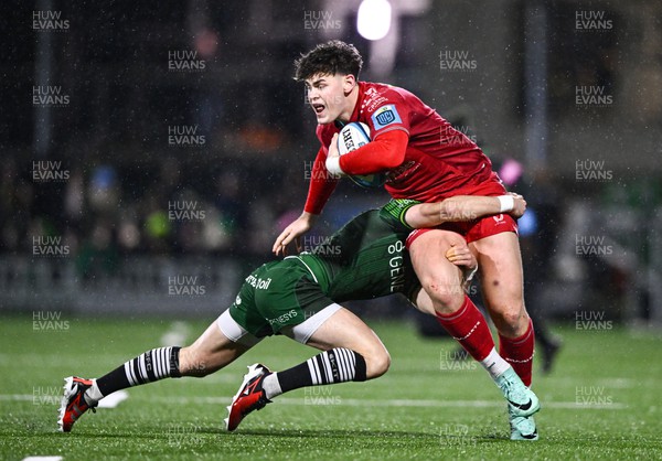 020324 - Connacht v Scarlets - United Rugby Championship - Eddie James of Scarlets is tackled by Michael McDonald of Connacht