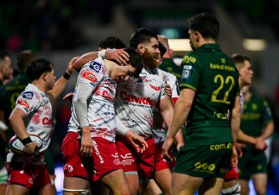 130326 - Connacht v Scarlets - United Rugby Championship - Ioan Jones of Scarlets, left, celebrates with teammate Kemsley Mathias after scoring their side's second try