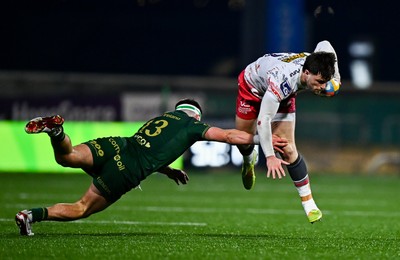 130326 - Connacht v Scarlets - United Rugby Championship - Joe Roberts of Scarlets evades the tackle of John Devine of Connacht