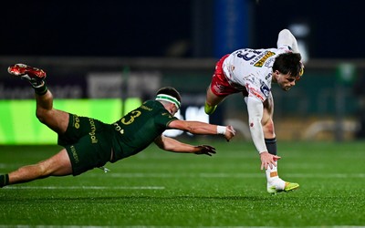 130326 - Connacht v Scarlets - United Rugby Championship - Joe Roberts of Scarlets evades the tackle of John Devine of Connacht