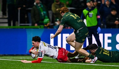 130326 - Connacht v Scarlets - United Rugby Championship - Jac Davies of Scarlets dives over to score his side's third try despite the efforts of Shane Jennings of Connacht which was subsequently disallowed