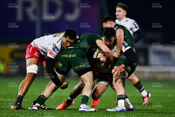 130326 - Connacht v Scarlets - United Rugby Championship - Johnny Williams of Scarlets, right, assisted by team-mate Sam Lousi is tackled by, Cathal Forde, left, and Dylan Tierney-Martin of Connacht