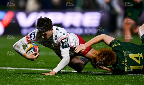 130326 - Connacht v Scarlets - United Rugby Championship - Ioan Jones of Scarlets dives over to score his side's second try despite the tackle of Shane Jennings of Connacht