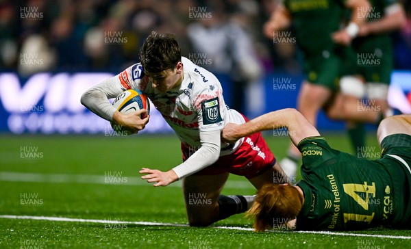 130326 - Connacht v Scarlets - United Rugby Championship - Ioan Jones of Scarlets dives over to score his side's second try despite the tackle of Shane Jennings of Connacht