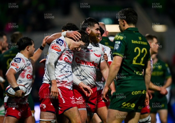 130326 - Connacht v Scarlets - United Rugby Championship - Ioan Jones of Scarlets, left, celebrates with teammate Kemsley Mathias after scoring their side's second try