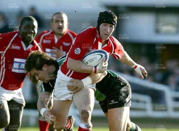 180206 - Connacht v Llanelli -  Llanelli's Barry Davies gets tackled by Matt Lacey of Connacht 