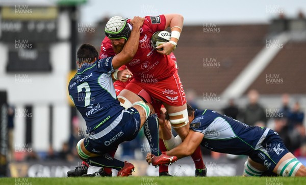 220918 - Connacht v Scarlets - Guinness PRO14 -  Jake Ball of Scarlets is tackled by Jarrad Butler, left and Quinn Roux of Connacht