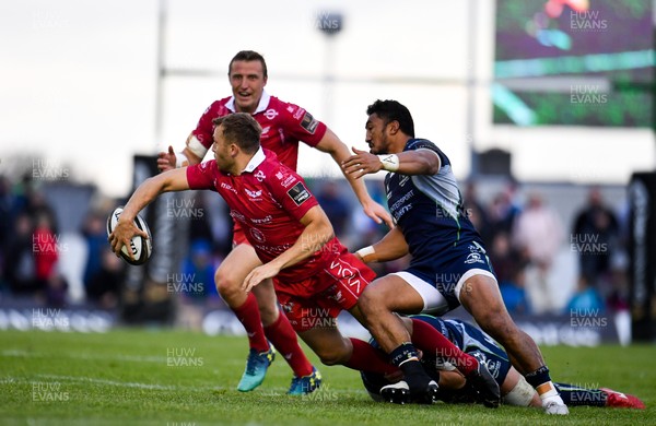 220918 - Connacht v Scarlets - Guinness PRO14 -  Tom Prydie of Scarlets is tackled by Tom Farrell, hidden, and Bundee Aki of Connacht