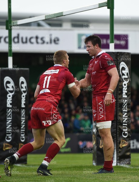 220918 - Connacht v Scarlets - Guinness PRO14 -  Johnny McNicholl of Scarlets, left, celebrates after scoring his side's first try with teammate Ed Kennedy 