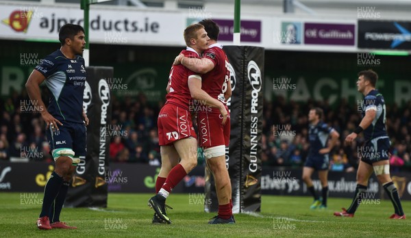 220918 - Connacht v Scarlets - Guinness PRO14 -  Johnny McNicholl of Scarlets, left, celebrates after scoring his side's first try with teammate Ed Kennedy 