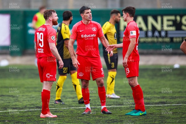 070721 - Connah's Quay Nomads v FC Alashkert - UEFA Champions League First Qualifying Round First Leg - Craig Curran (19), Michael Wilde (9) and Aeron Edwards (23) of Connah’s Quay Nomads talk during a break in play