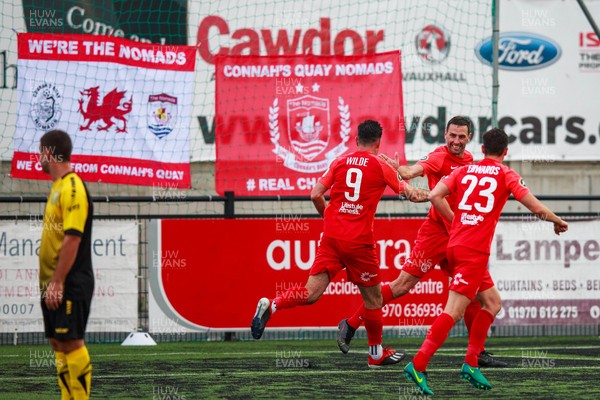 070721 - Connah's Quay Nomads v FC Alashkert - UEFA Champions League First Qualifying Round First Leg - George Horan (5) of Connah’s Quay Nomads celebrates with Michael Wilde (9) and Aeron Edwards (23) after scoring
