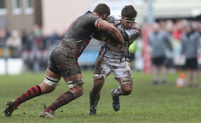 060414 - Cornish Pirates v Pontypridd, British and Irish Cup Quarter Final - Pontypridd's Owen Jenkins is tackled by Pirates' Darren Barry