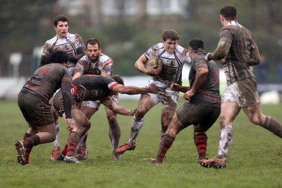 060414 - Cornish Pirates v Pontypridd, British and Irish Cup Quarter Final - Pontypridd's Garyn Smith is held by Pirates' Kieran Hallett and Pirates' Ben Prescott