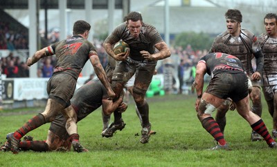 060414 - Cornish Pirates v Pontypridd, British and Irish Cup Quarter Final - Pontypridd's Dan Godfrey is tackled