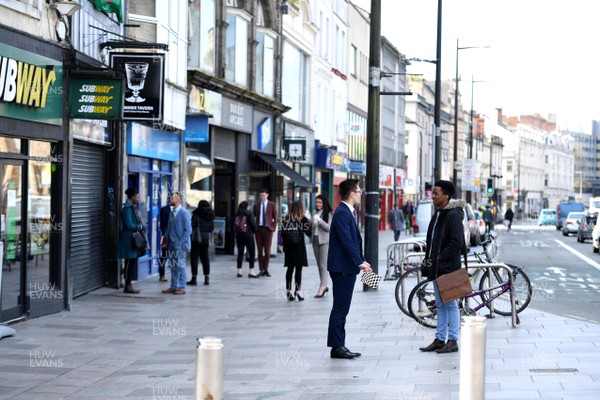 230320 - Coronavirus Outbreak - Company staff hold meeting with clients in the streets in Cardiff City centre during Monday morning